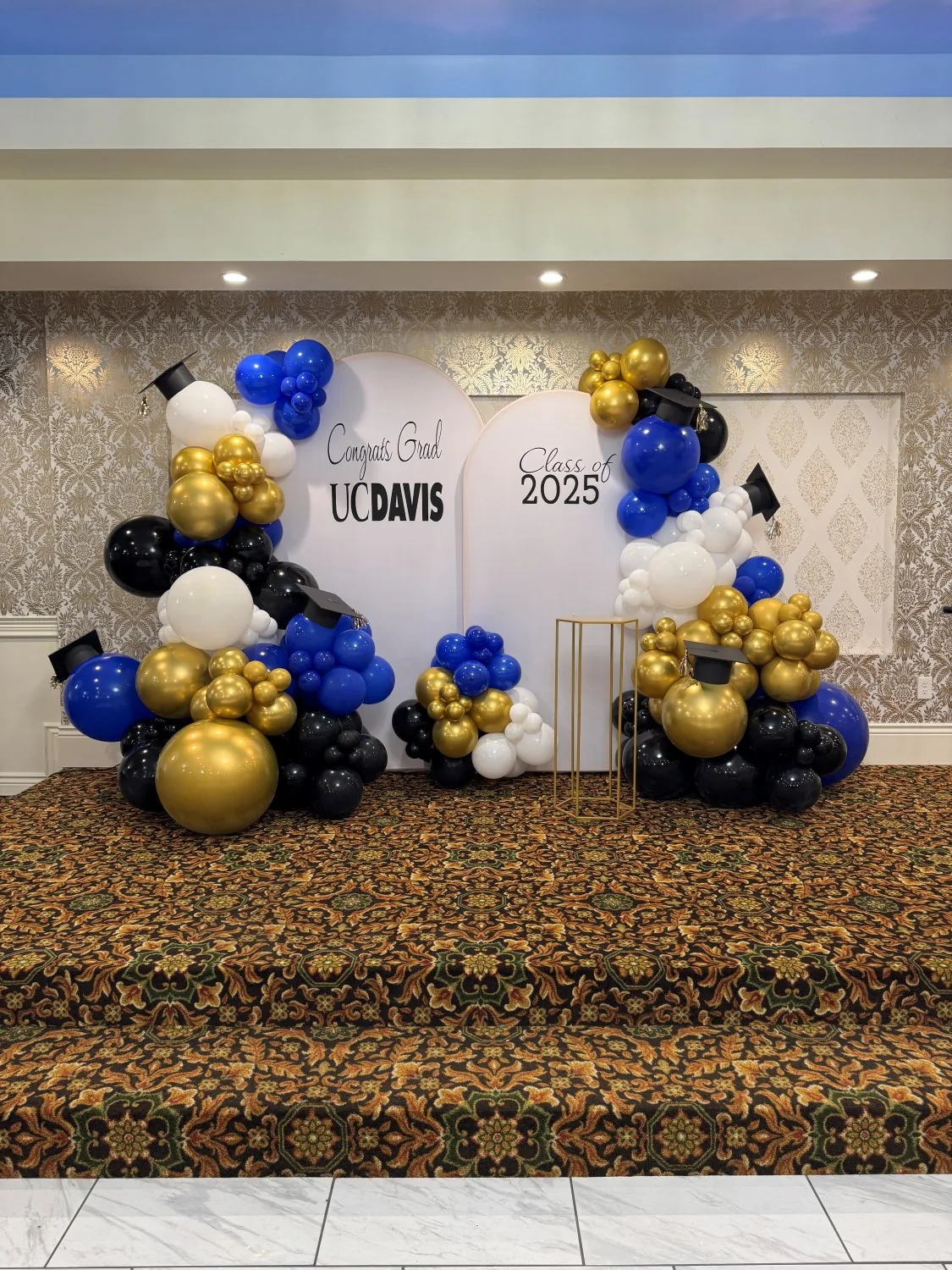 UC Davis graduation balloon backdrop blue and gold Sacramento